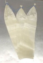 Fibrous casings are non-edible and string tied at one end. These casings are clear and can be used for making various cured sausages such as strassburg and salami.